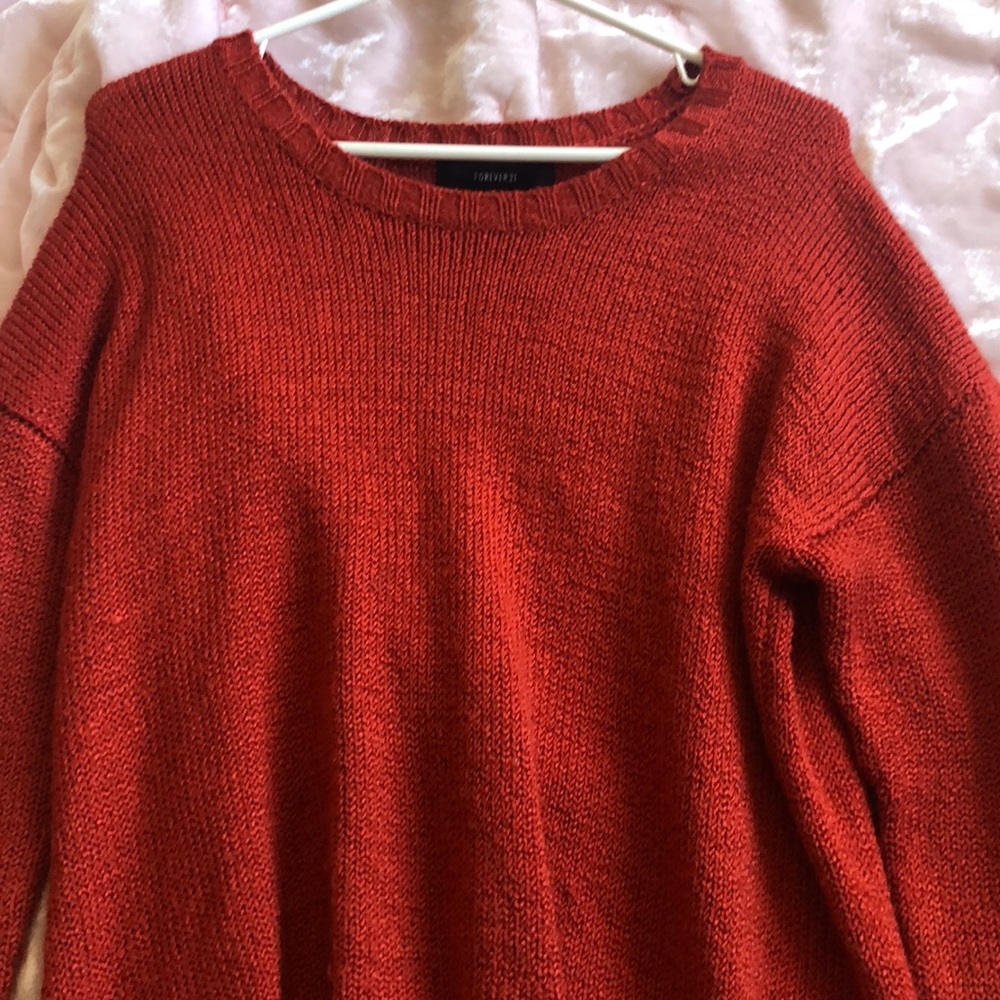 red orange sweater